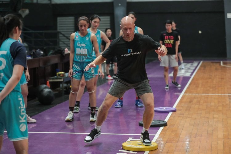Basketball training session with athletes on court