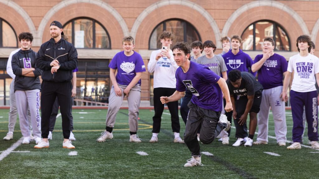 Group of athletes training on a sports field.