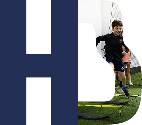 Child running agility drill indoors