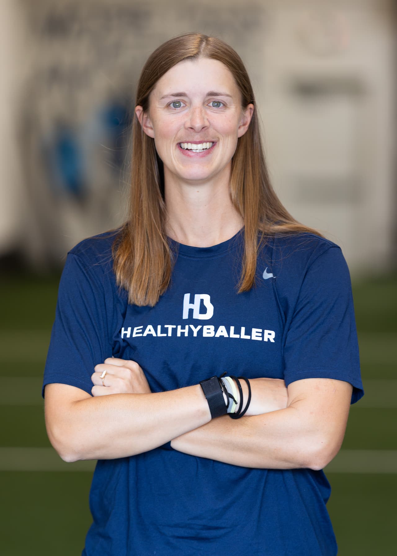 Smiling woman in Healthy Baller shirt