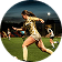 Female soccer player kicking ball during night game.