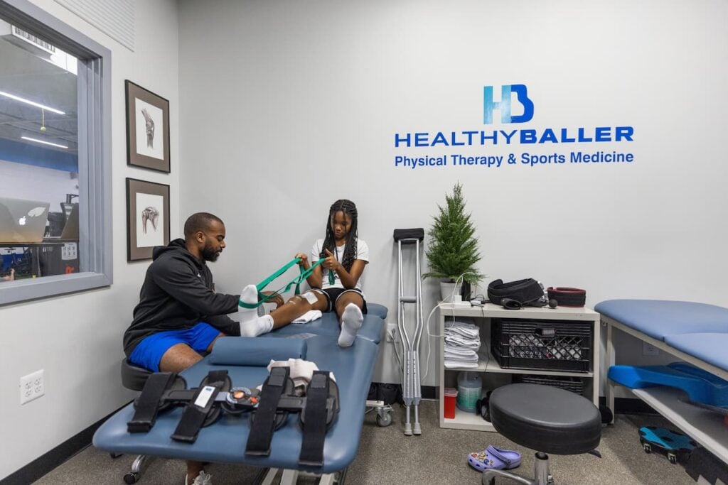 Physical therapy session at Healthy Baller clinic.