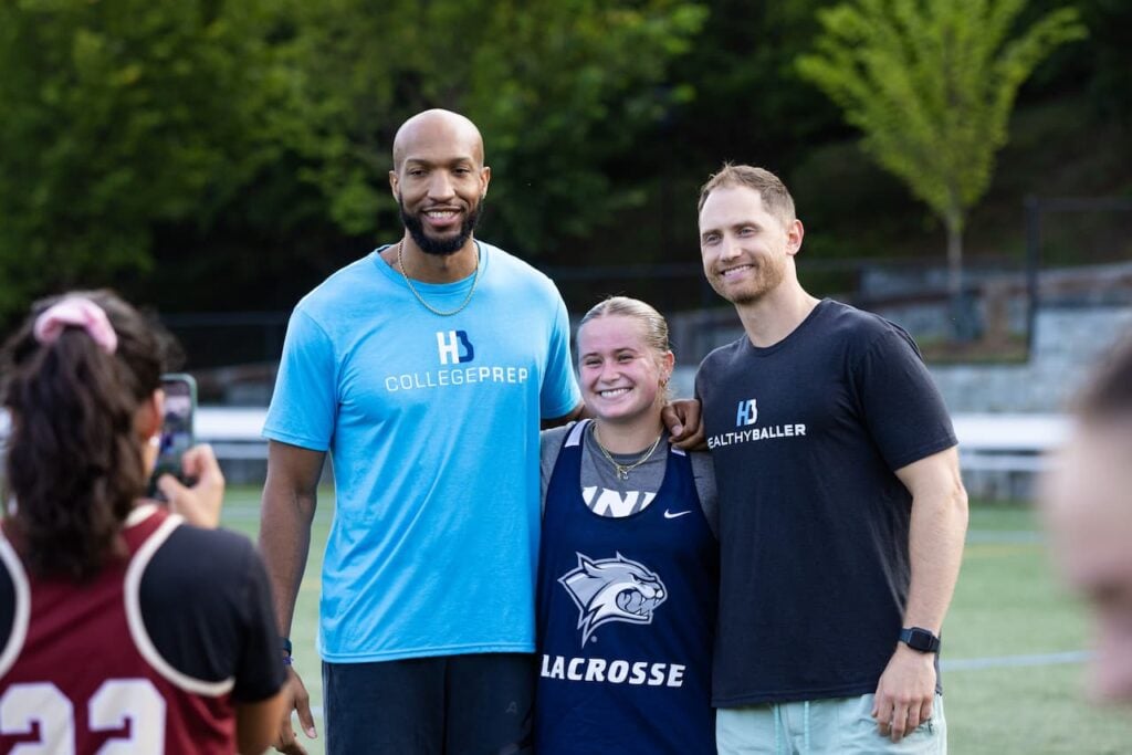 Three people posing for a lacrosse photo.