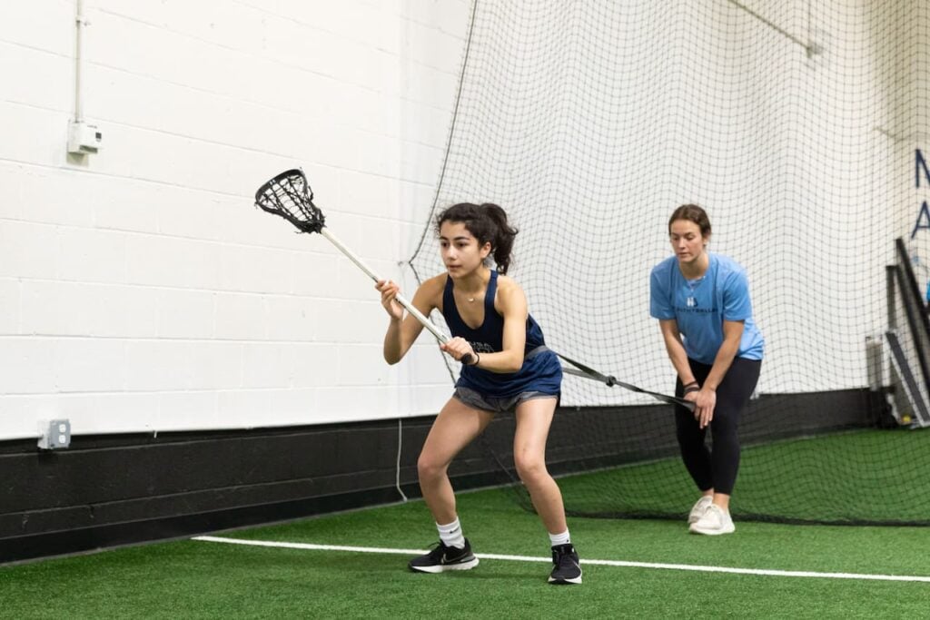 Lacrosse training with resistance band indoors