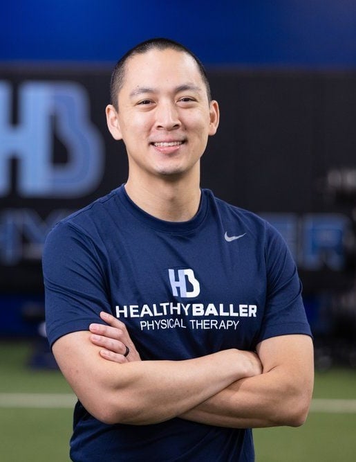 Smiling athlete in Healthy Baller gym.