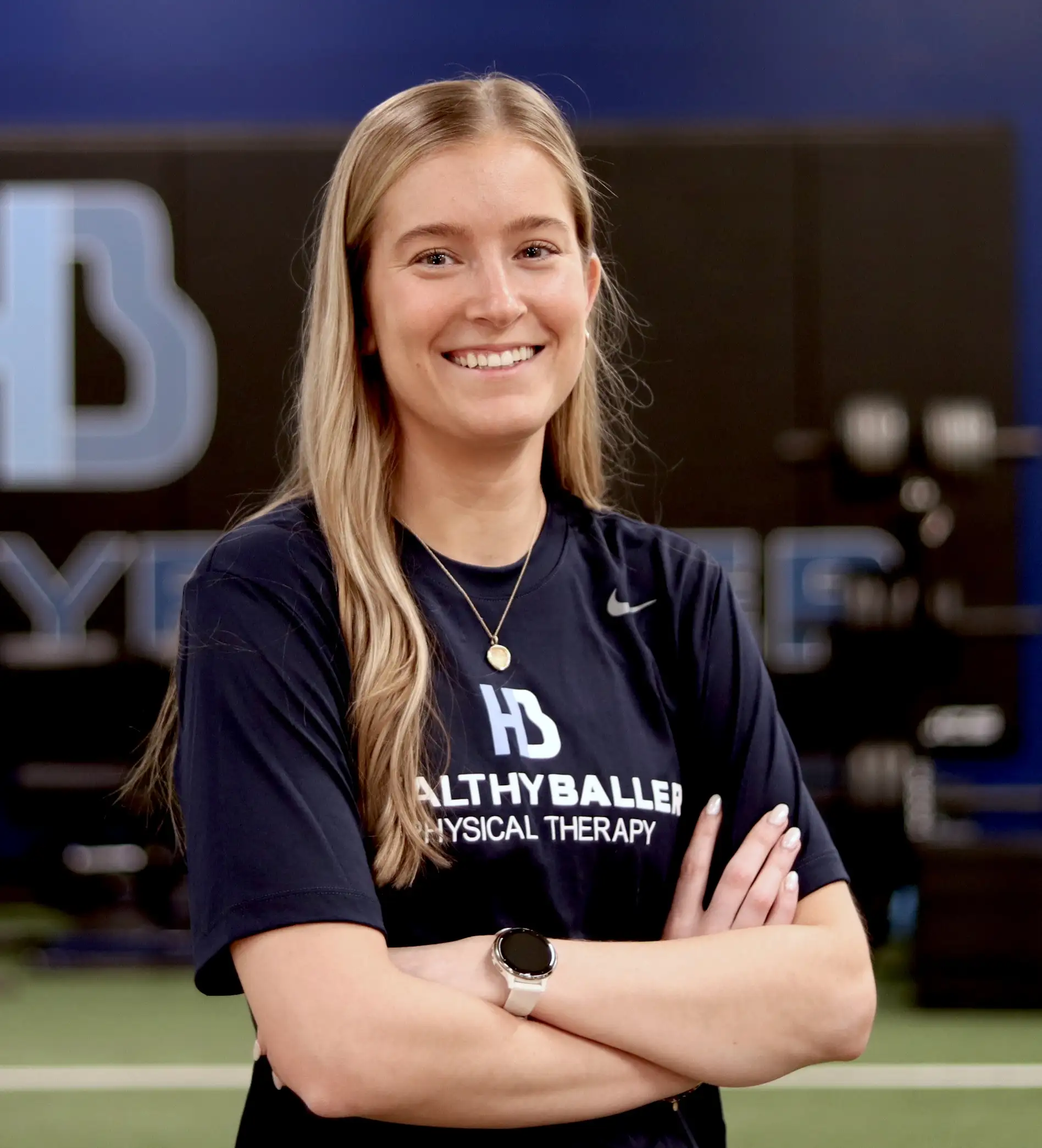 Smiling woman in sports therapy center.