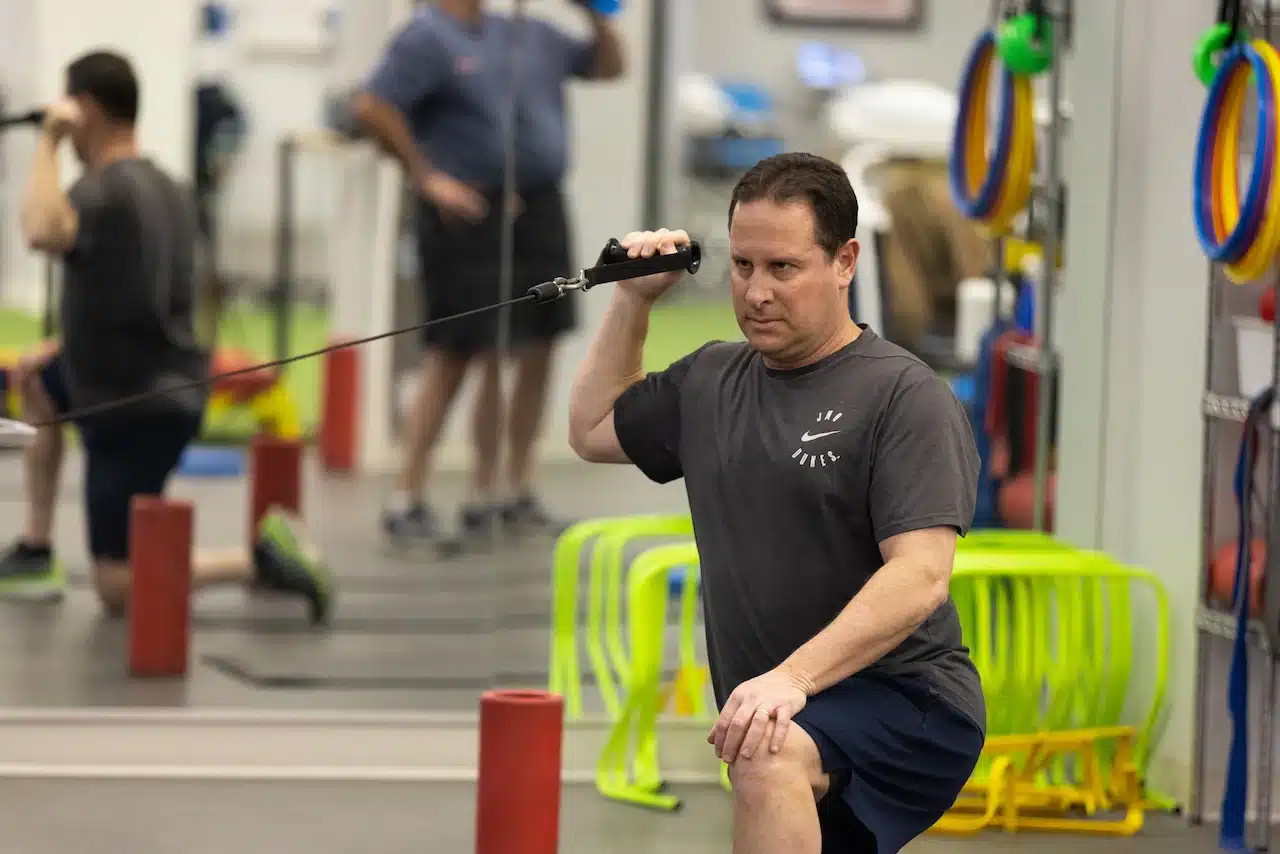 Man exercising with a cable machine